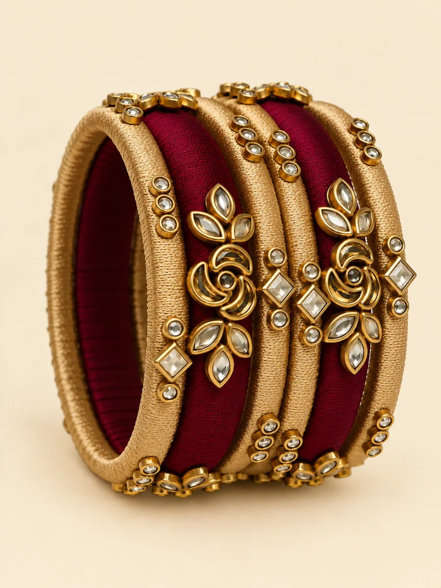 Maroon and Gold handmade kundhan silk thread bangles — Handcrafted maroon and gold silk thread bangles adorned with elegant Kundan stones and traditional floral and geometric detailing.
